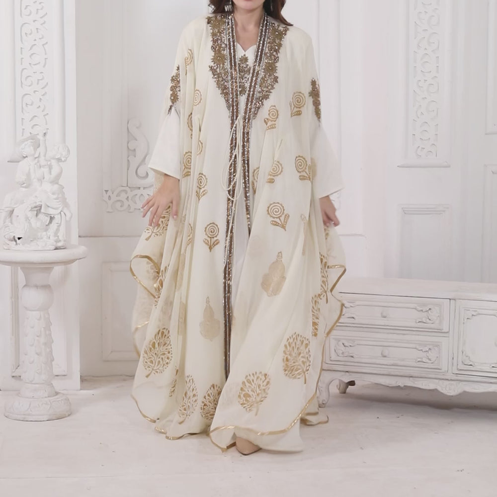 
                  
                    Charger et lire la vidéo dans la visionneuse de la galerie, Designer Kaftan Flowy Arabic Dress with Hand Embroidery and Block print
                  
                